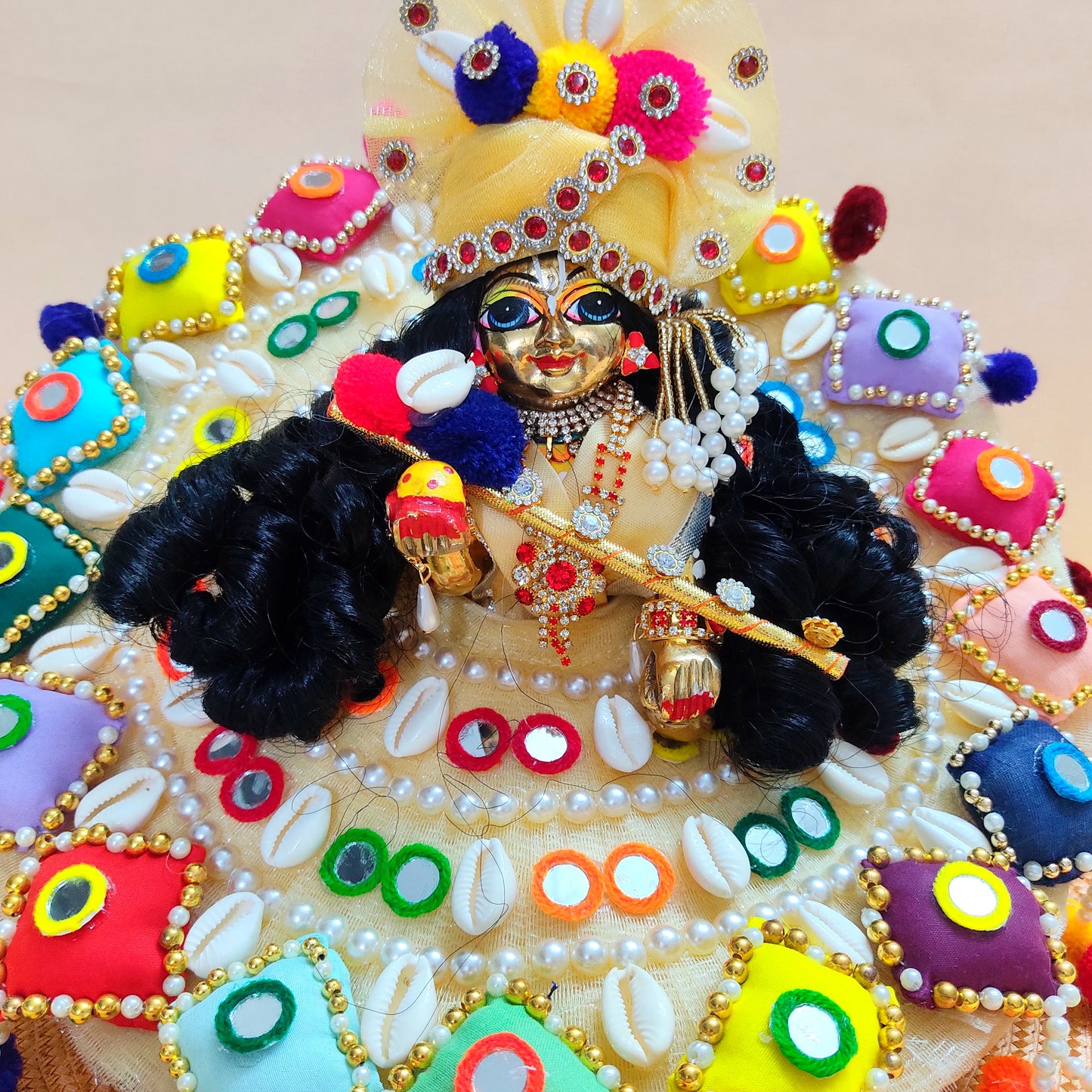 Colorful Designer Kanha Ji Dress – 3D Handmade Patches, Cowrie Beads, Mirror Work, Pom-Poms with Matching Mukut & Full Shringar Set