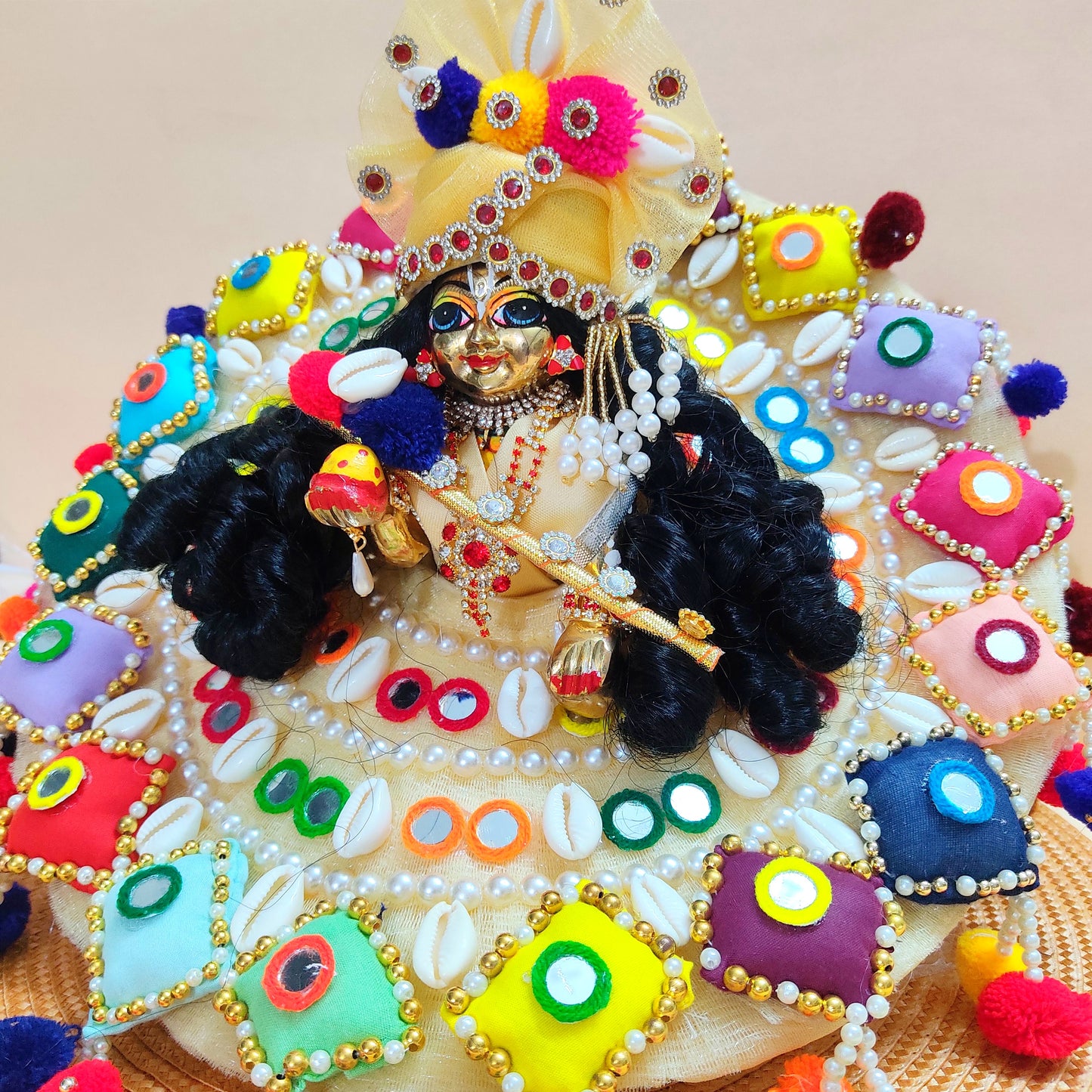 Colorful Designer Kanha Ji Dress – 3D Handmade Patches, Cowrie Beads, Mirror Work, Pom-Poms with Matching Mukut & Full Shringar Set