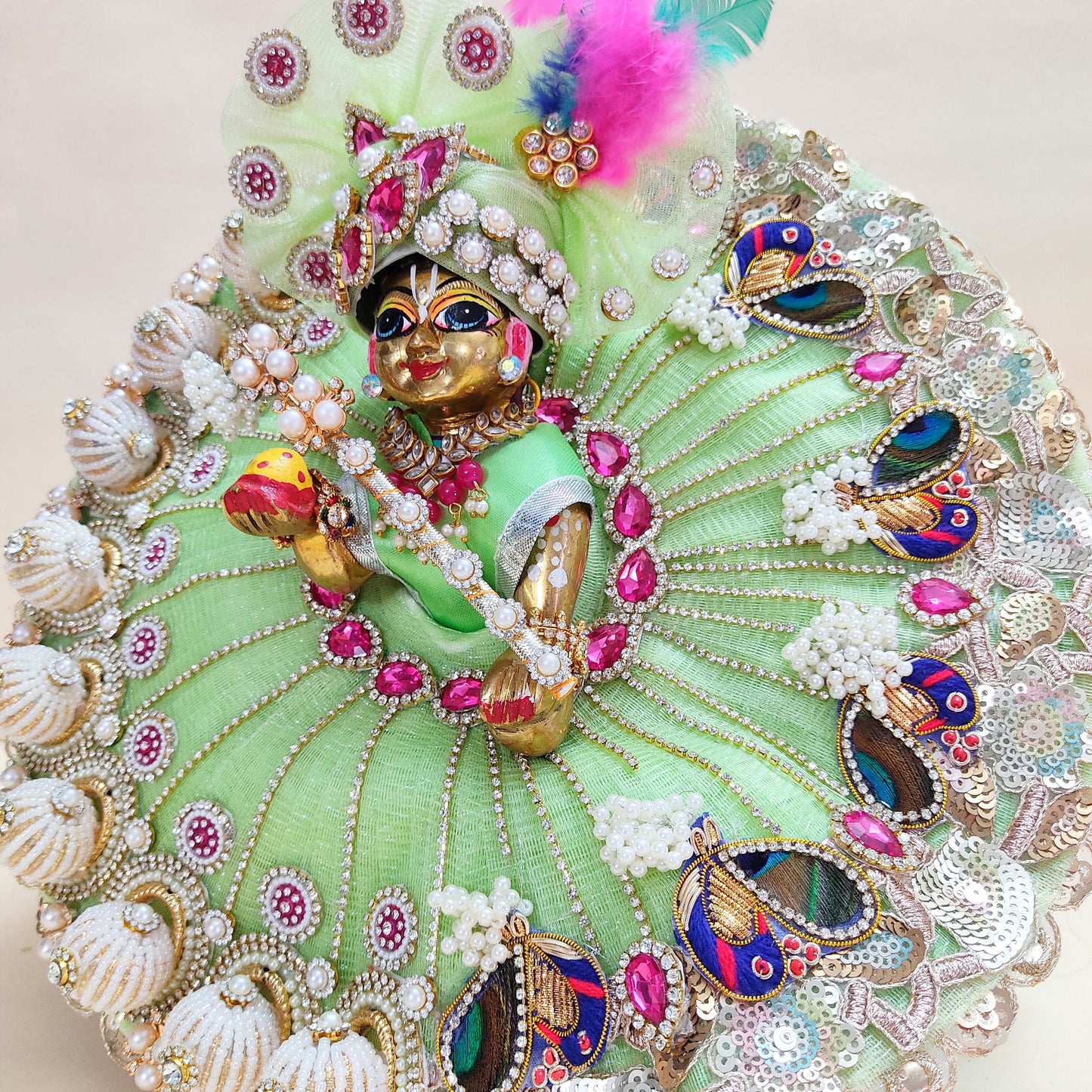 Diwali Special Green Laddu Gopal Dress with 3D Pearl Balls, Zari Peacock Patches & Diamond Chain Work with Matching Mukut, Pataka Set, Bansuri & A Surprise Gift.