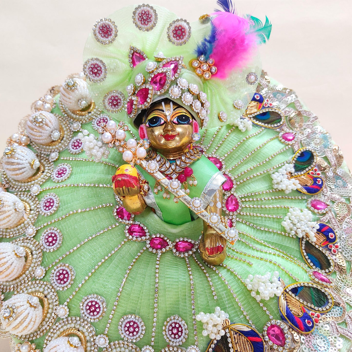 Diwali Special Green Laddu Gopal Dress with 3D Pearl Balls, Zari Peacock Patches & Diamond Chain Work with Matching Mukut, Pataka Set, Bansuri & A Surprise Gift.