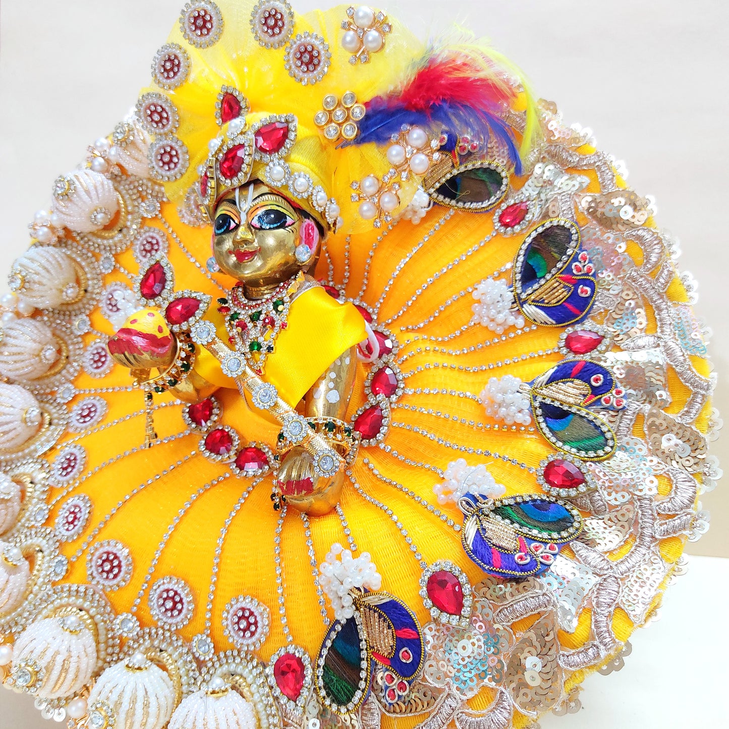 Diwali Special Yellow Laddu Gopal Poshak with 3D Pearl Balls, Zari Peacock Patches & Diamond Chain Work with Matching Mukut, Pataka Set, Bansuri & A Surprise Gift.